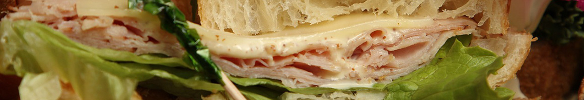 Eating Deli Sandwich at Bagel Hut restaurant in Matawan, NJ.